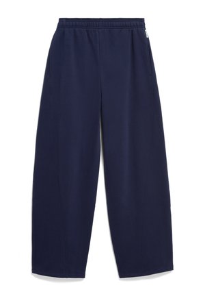 Navyblaue weit geschnittene Sweatpants mit elastischem Bund und seitlichen Taschen, flach auf weißem Hintergrund liegend.