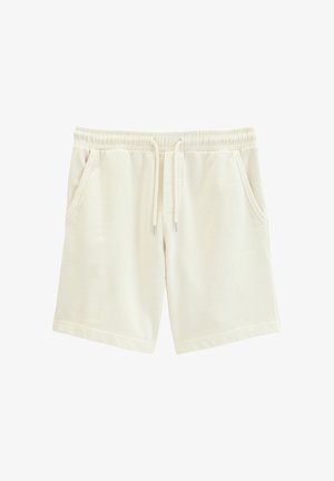 Beige Freizeithosen mit elastischem Bund, Kordelzugverschluss und Seitentaschen, vor weißem Hintergrund gezeigt.