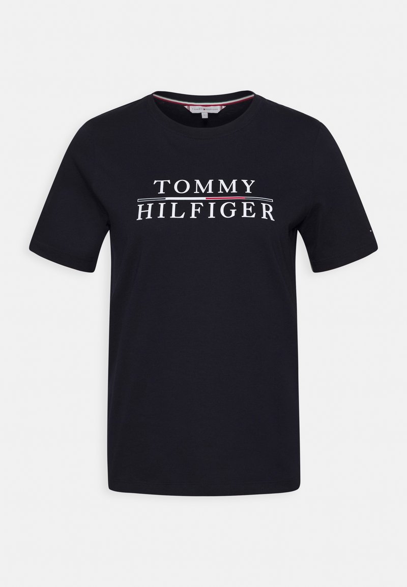 Navy blue cotton t-shirt with short sleeves and crew neck. Features a white logo with "TOMMY HILFIGER" on the front, accented by red lines.