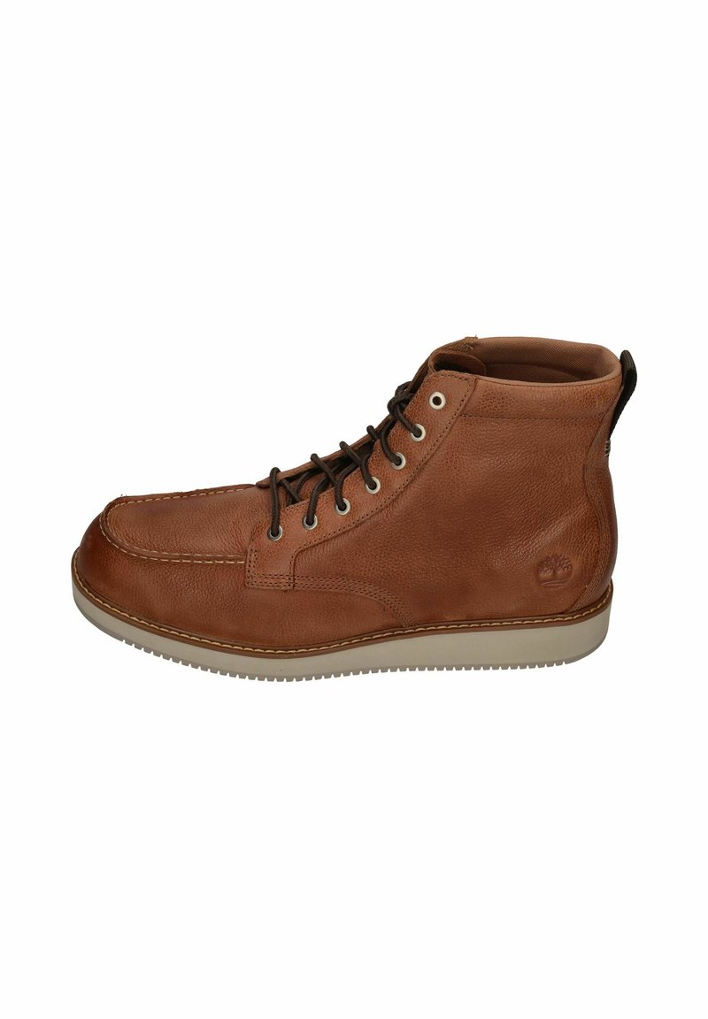 Brown leather boot with a textured finish, rounded toe, and lace-up design. Features light-colored rubber sole and logo on the heel.