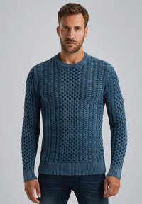 Kapuzensweater aus tiefblauem Kabelstrick. Mit einem strukturierten Muster, geripptem Rundhals und Bündchen. Hergestellt aus einem weichen, warmen Material.