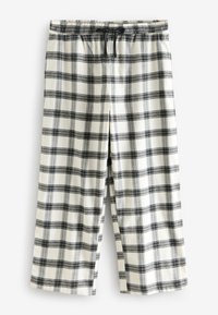 Pantaloni del pigiama a quadri bianchi e neri con vita elastica e coulisse nera, distesi su sfondo bianco.