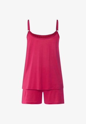 Canottiera rosa brillante senza maniche con spalline regolabili abbinata a pantaloncini larghi coordinati.