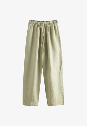 Jasnobeżowe spodnie o szerokich nogawkach z elastycznym pasem i sznurkiem z przodu, wykonane z teksturowanej tkaniny.