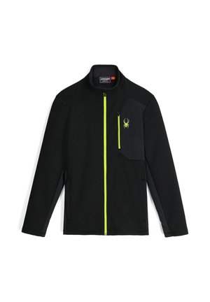 Schwarze Full-Zip-Jacke mit neongelbem Reißverschluss, Brusttasche und Spinnenlogo auf der rechten Brust, langen Ärmeln und Stehkragen.