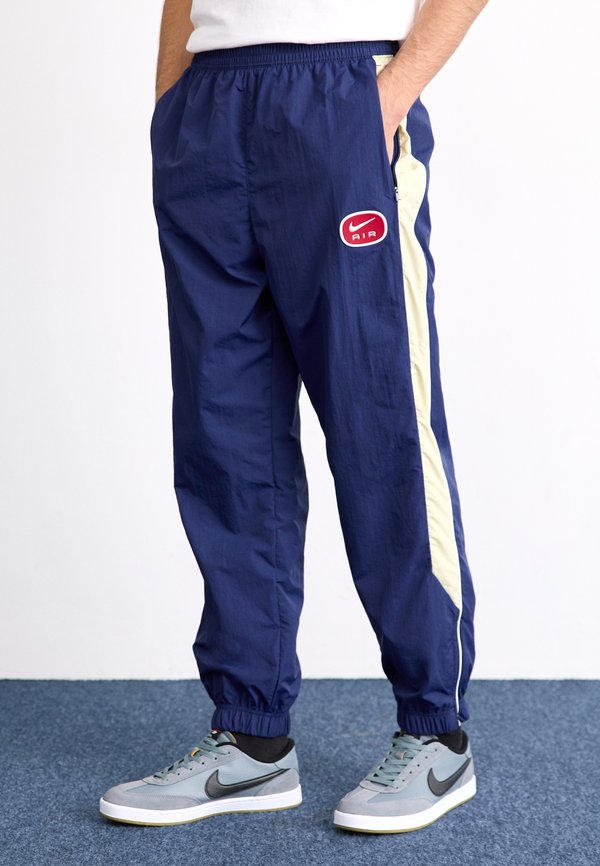 AIR PANT - Tracksuit bottoms