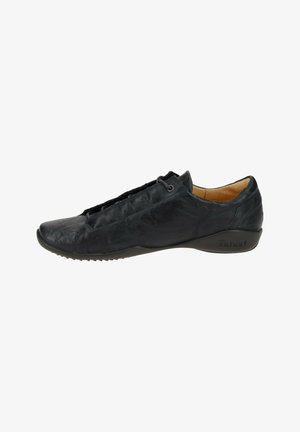 Black leather shoe with a streamlined design, featuring a textured upper, laces, and a rubber sole with pronounced tread for grip.