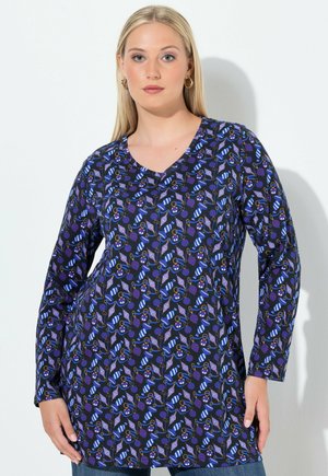 Long-sleeve tunic in dark blue with a repeating pattern of colorful dessert items and utensils, featuring a V-neckline and relaxed fit.