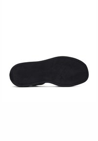 Suola di scarpa in gomma nera con finitura testurizzata. Presenta una forma arrotondata e una leggera curvatura lungo i bordi. Design minimal con nessun marchio visibile.