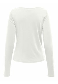 Witte langmouw t-shirt van zacht, soepel materiaal. Heeft een ronde halslijn en een rechte zoom zonder patronen of versieringen.