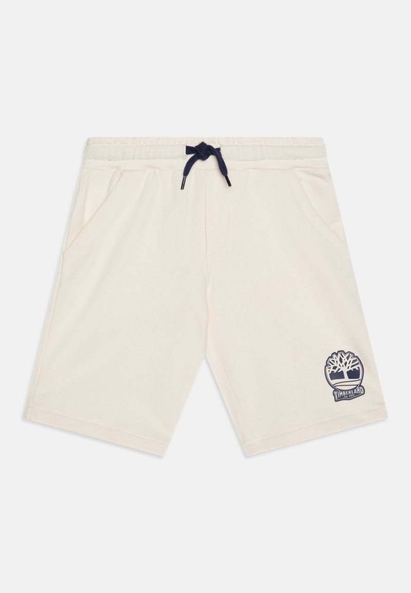 Shorts décontractés de couleur blanc cassé avec taille élastique, cordon de serrage bleu marine, poches latérales et patch logo Timberland sur la partie inférieure de la jambe gauche.