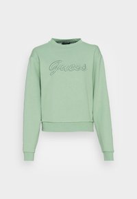 Felpa verde menta realizzata in tessuto morbido, con collo rotondo, maniche lunghe e la scritta "Guess" ricamata in corsivo sul petto.