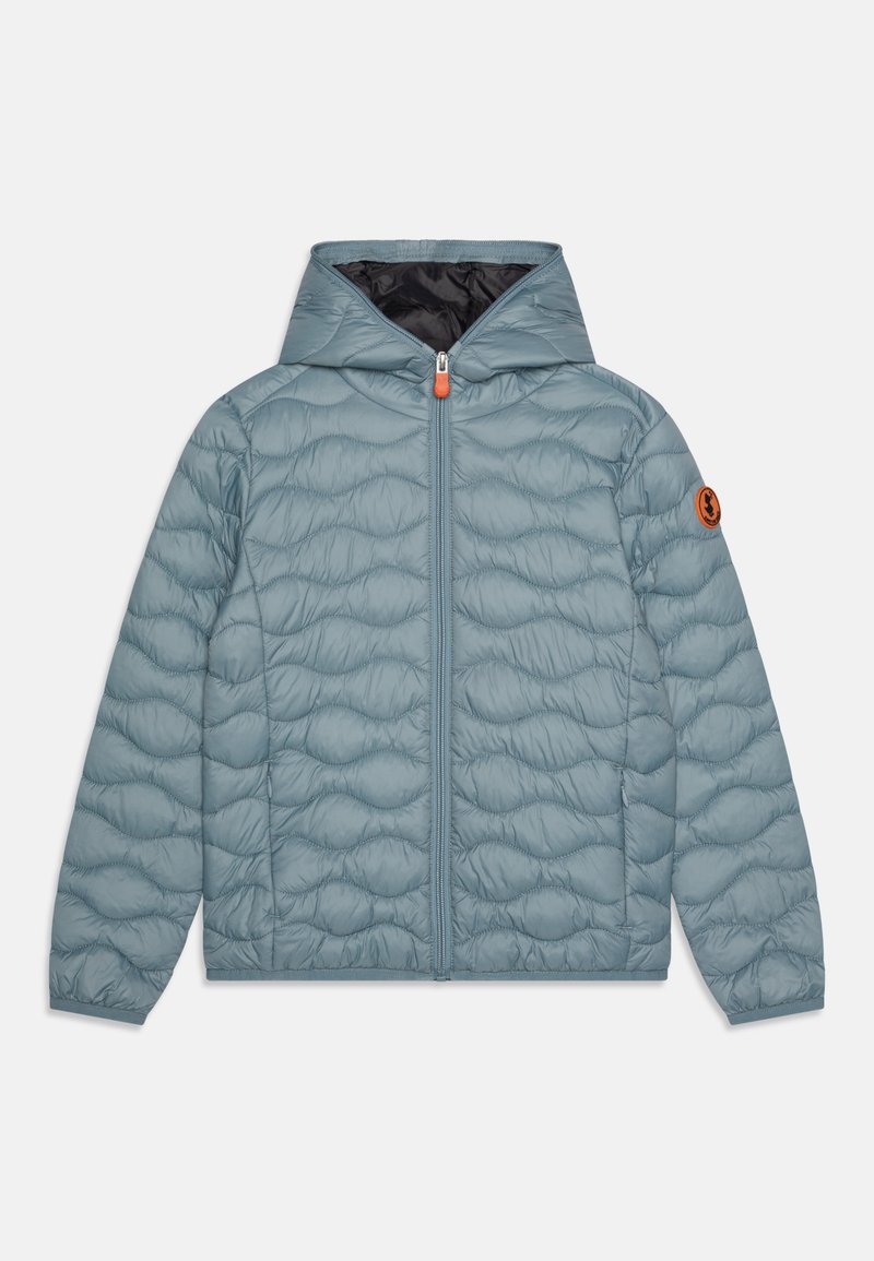 Light blue quilted jacket with a hood, featuring a front zipper and an orange pull tab. Contains a logo patch on the left sleeve.