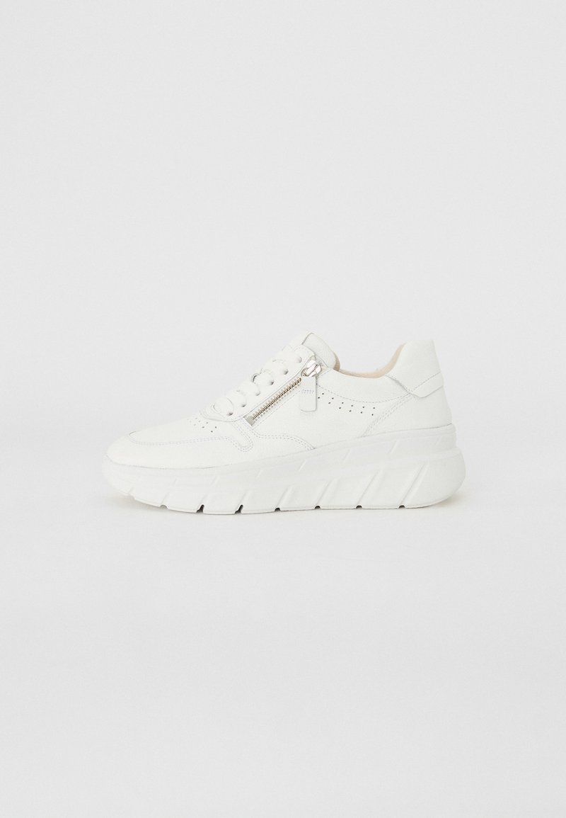 White sneaker featuring a textured upper, lace closure, side zipper, and a thick, ridged sole for added height and support.