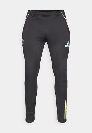 Czarne sportowe spodnie o dopasowanym kroju, z różowymi i turkusowymi akcentami, bocznymi kieszeniami oraz żółtymi paskami przy kostkach.