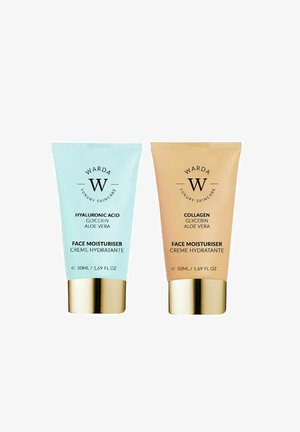 Two tubes of moisturizer, one light blue and one light brown, both with gold caps. Labels indicate hyaluronic acid and collagen formulas.