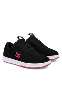 Black suede sneakers with mesh detailing, featuring a pink DC logo, white midsole, and pink accent on the outsole. Laced design.