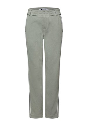 Světlé zelené sportovní kalhoty se stahovací šňůrkou v pase, bílými pruhy po stranách, rovnými nohavicemi a měkkou, strukturovanou tkaninou.