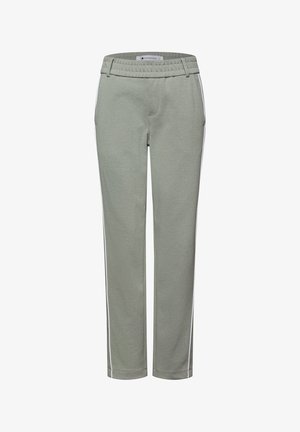 Pantalon de sport vert clair avec une taille à cordon de serrage, des bandes blanches sur les côtés, des jambes droites et un tissu doux et texturé.