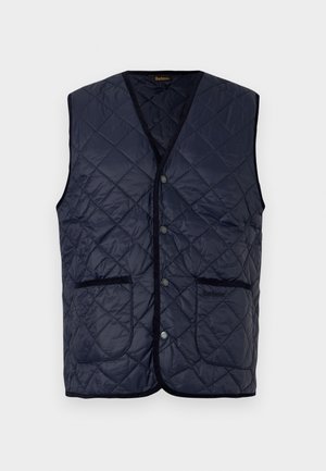 Navyblauwe gewatteerde vest met drukknoopsluitingen, twee voorzakken en zwarte bies langs de randen en armlopen.