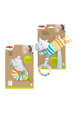 Two colorful striped zebra baby toys by HABA with rings and beads, each attached to brown packaging with a child’s photo.