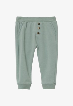 Hellgrüne Baumwollhose mit elastischem Bund, drei braunen Knöpfen vorne, seitlichen Taschen und gerippten Bündchen.