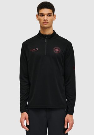 Black long-sleeve pullover with a quarter zipper, textured fabric, featuring maroon logos and accents on the front and sleeve.