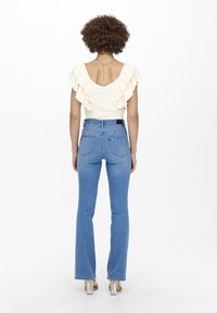 ONLY ONLWAUW LIFE FLARE  - Flared jeans - light medium blue