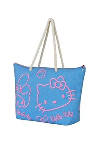 Bolso de lona azul con gráficos de un gato de dibujos animados en rosa, que cuenta con un asa de cuerda y un cierre de cremallera en el borde superior.