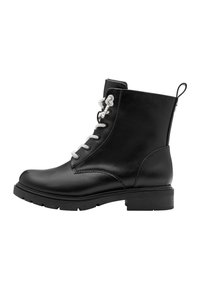 Bottines en cuir noir avec des lacets argentés, bout rond et semelle à grip en caoutchouc. Dotées d'une languette à l'arrière pour un enfilage facile.
