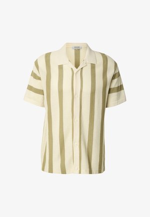 Lyhythihainen, nappikiinnitteinen paita luonnonvalkoisena, jossa vihreät vaakaraidat. Valmistettu teksturoidusta kankaasta, ja siinä on kaulus sekä viisi nappia.