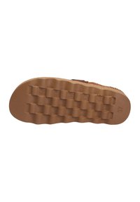 Brown rubber shoe sole with a textured, patterned surface featuring raised sections and a stamped size label "37."