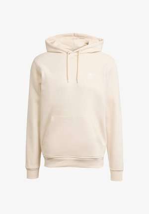 Beige hoodie gemaakt van zachte stof, met een voorzak, trekkoord kap, en een wit logo op de borst. Geribbelde manchetten en onderrand.