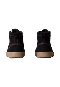 Stivaletti alla caviglia in suede blu scuro con motivo texturizzato, suola marrone chiaro a contrasto e una linguetta sul retro per una facile calzata.