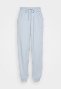 Pantalons de survêtement bleu clair avec taille élastique et cordon de serrage, présentant des bandes latérales blanches et un petit logo blanc sur la cuisse gauche.