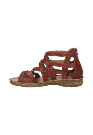 Sandale en cuir rouge avec plusieurs brides, design ouvert et semelle texturée. Présente une fermeture éclair à l'arrière pour un enfilage facile.