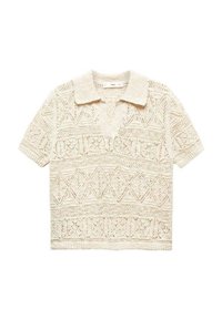 Polo en dentelle tricoté à manches courtes en blanc cassé, avec des motifs géométriques et un col avec un plastron partiel.