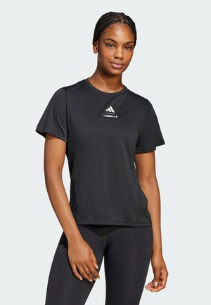 Black athletic t-shirt with short sleeves, round neckline, and a small white logo on the chest. Soft, breathable fabric suitable for workouts.