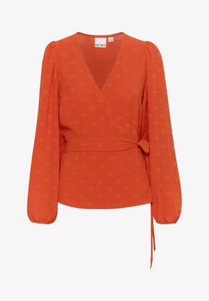 Piros, hosszú puff ujjú blúz, texturált anyagból, önkötözős derékkal. Finom mintázat világosabb vörös árnyalatban.