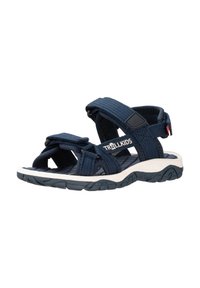 Dunkelblaue Outdoor-Sandalen mit Stoffriemen und Klettverschlüssen, die eine weiße Gummisohle mit strukturiertem Grip-Muster aufweisen.