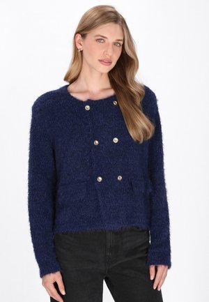 Navy blue fuzzy cardigan with a round neckline, double-breasted design, gold-tone buttons, and long sleeves. Soft texture.