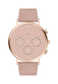 Roségouden horloge met een roze wijzerplaat, ronde wijzerplaat, minimalistische uurmarkeringen, een zachte roze leren band en drie kleinere wijzerplaten voor datum en dag.