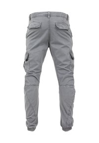 Pantalones cargo grises con un ajusteSlim, que cuentan con bolsillos laterales, puños elásticos y detalles de costura en las rodillas. Fabricados en un tejido ligero.