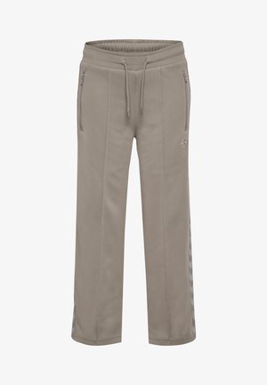 Helle beige Jogginghosen aus weichem Stoff. Verfügen über seitliche Reißverschlusstaschen und subtile, strukturierte Streifenakzente an den Seiten. Elastischer Bund.