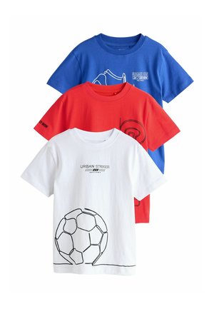 Three stacked short-sleeve kids' t-shirts in blue, red, and white, each with sports-themed graphic prints and text.