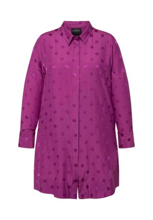 Violetti nappipaidassa on sileä satiinipinta, jossa on pilkkukuosi. Pitkät hihat ja klassinen kaulustyyli.
