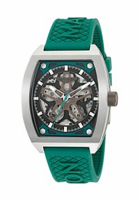 Sudraba krāsas skeleta ciparnīca ar ķiršu akcentiem, redzama mehāniskā kustība un teksturēta ķiršu gumijas josta.