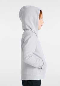 Light gray hoodie with a kangaroo pocket, featuring a drawstring hood and subtle embroidered details. Soft fabric with a smooth texture.