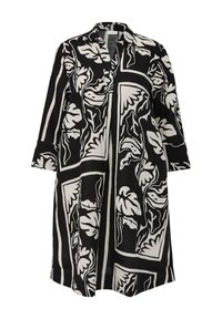 Robe chemise à motifs noir et blanc avec un col, des manches trois-quarts et une coupe décontractée. Les motifs floraux sont encadrés par des lignes géométriques.