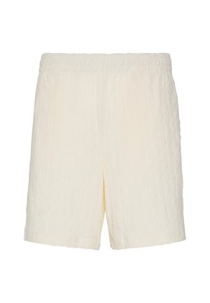 Κρεμ κοντά σόρτς με διπλό ράψιμο, ελαστική μέση και διακριτικό διαμαντένιο σχέδιο στο ύφασμα, εμφανίζονται σε απλό λευκό φόντο.